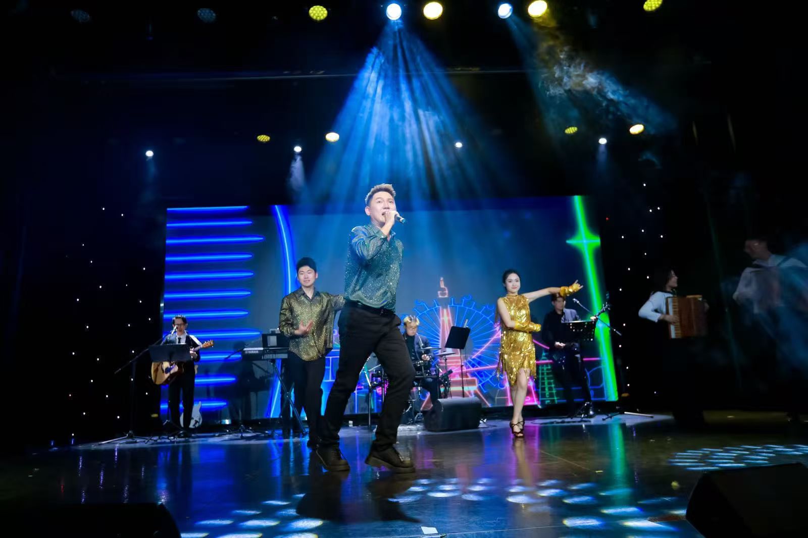 Bryan.T performing on a large stage